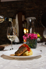 Grilled fish, mashed potatoes, passion fruit sauce, wine