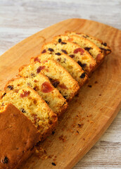 Raisin and candid cherry cake, sliced
