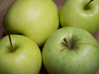 Renet simirenko green apples, top view, close-up. Macro shot of fruit.