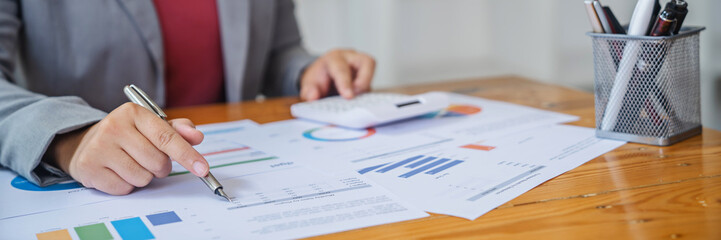 Business Professional Accountant Woman working on laptop computer making research for planning startup at desktop working process in office