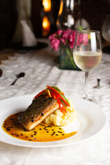 Grilled fish, mashed potatoes, passion fruit sauce, wine