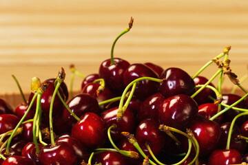 Hill of cherries with stalks on the table