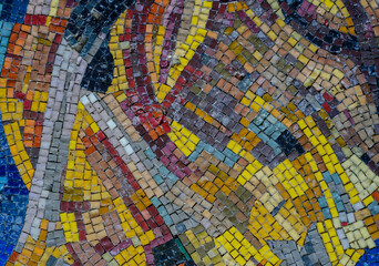 detailed mosaic of colorful stones on the wall, pattern, background, texture.