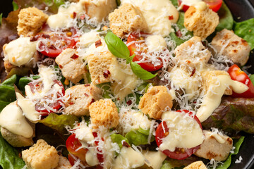 Vegetarian ceasar salad with meat free chicken pieces cherry tomatoes croutons and lettuce - obrazy, fototapety, plakaty