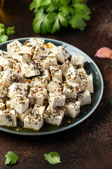 Vegan Tofu feta cheese with dried oregano, basil, thyme and garlic. Healthy Food.