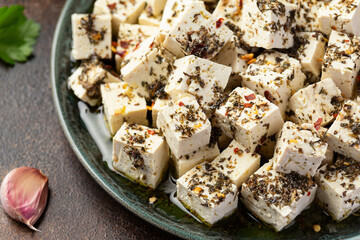 Vegan Tofu feta cheese with dried oregano, basil, thyme and garlic. Healthy Food.