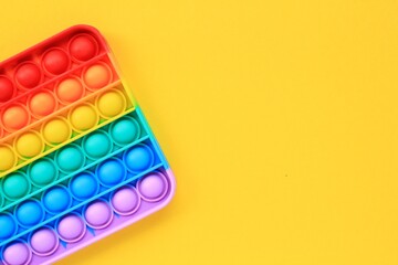 Pop it silicone rubber push antistress fidget toy. Sensory relief game for autism. Trendy popular hype poppit. Rainbow shape. Therapy, education, motor skills for childs and adults. Top view, flat lay