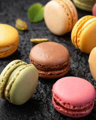 Homemade macarons chocolate, pistachio, lemon and raspberry french sandwich cookies