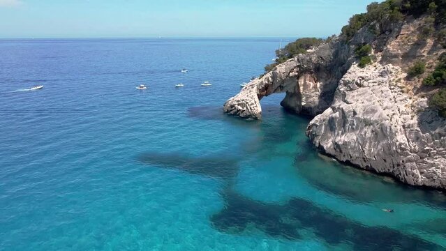 Cala Goloritze beach with crystal clear waters seen from the drone, Sardinia, Italy