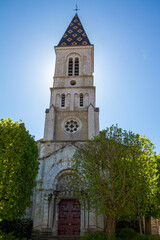 Fototapeta na wymiar Nuits-Saint-Georges, France, April 17, 2022. Facade of the Saint Denis church