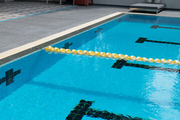 Swimming pool with blue water at hotel.