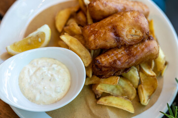 Fried fish and slice potato over the table