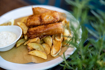 Fried fish and slice potato over the table