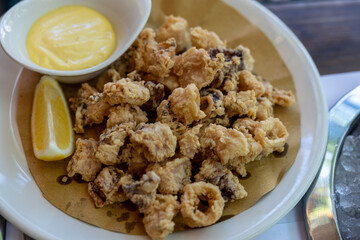 fried squid and mayonnaise sauce over the table