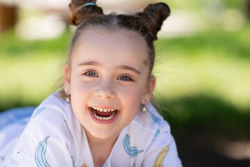 Adorable Little girl playing outdoor in park summertime