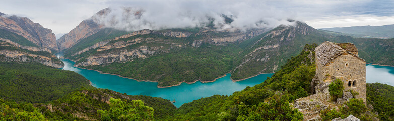 Romanesque hermitage of Santa Quiteria and San Bonifacio over Canelles reservoir , Catalonia, Spain.