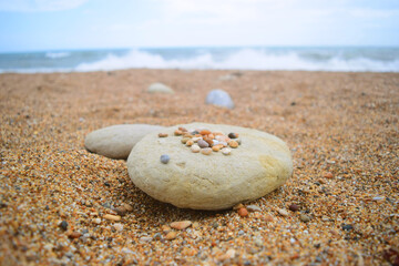 Fototapeta na wymiar close up of beautiful pebbles in a quiet beach in a calm summer day