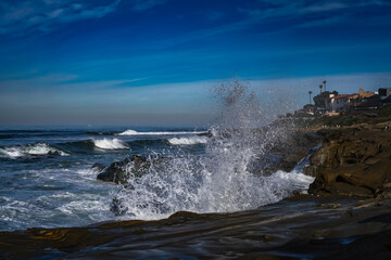 2022-06-18 WAVES CRASHING ON THE ROCKY SHORELINE AT ATHE WINDANSEA BEACH IN LA JOLLA CALIFORNIA