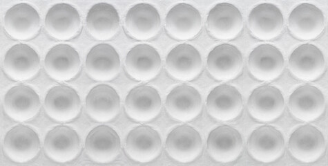 White round textured cardboard. Round geometric pits on cardboard