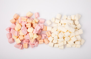 Fototapeta na wymiar Delicious white and pink marshmallows isolated on white background. Sweets with fruit flavor