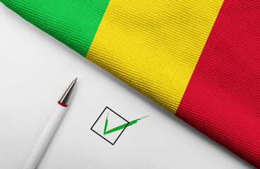 Pencil, Flag of Mali and check mark on paper sheet
