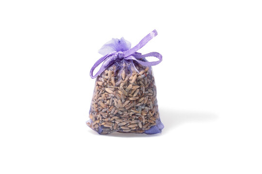 Lavender bag or pouch with dried lavender flowers isolated on white. Aromatic sachet with dry lavender