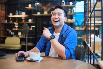 Fototapeta premium man drinking coffee in cafe