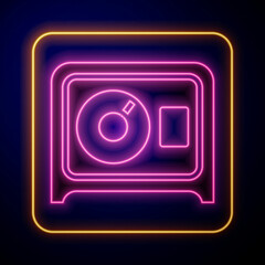 Glowing neon Safe icon isolated on black background. The door safe a bank vault with a combination lock. Reliable Data Protection. Vector