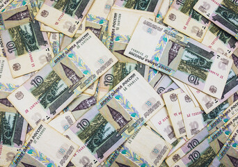 A lot of Russian ruble banknotes, stacks of banknotes, a pile of cash, paper money. The concept of financial success, investment and wealth. Pandemic crisis.