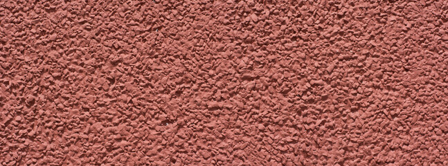 Concrete wall painted. Red. Textured. Copy space 