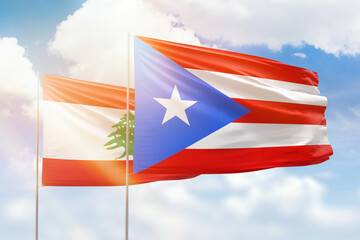 Sunny blue sky and flags of puerto rico and lebanon