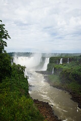 The photo shows a beautiful view of the Iguazu Falls, which are located on the border between Brazil and Argentina.