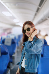 travel business Portrait of an Asian woman showing joy while waiting for a flight