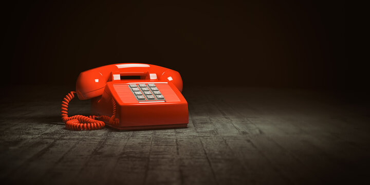 Red telephone on dirty background. Vintage retro push button telephone.