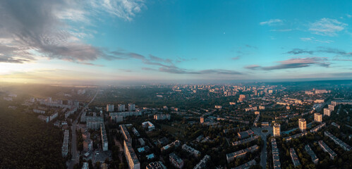 Sunny morning cityscape panorama in city residential district. Aerial colorful view above buildings and streets, Pavlovo Pole, Kharkiv Ukraine