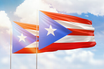 Sunny blue sky and flags of puerto rico and puerto rico