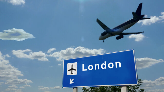 Plane landing in London England, UK airport with signboard