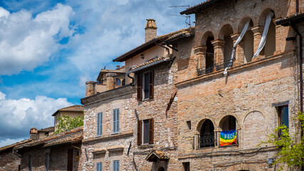 Old palaces facades in the city of Assisi (Umbria Region, central Italy). Ancient medieval city, is...
