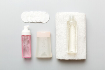 Micellar cleansing water and discs to remove cosmetics and cleanse the skin on colored background. Copy space top view