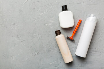 shaving man set. shaving machine, towel, lotion and shaving foam on colored background. Men bath Accessories top view