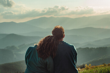 couple a man and a woman sit together bowing their heads on their shoulders and looking into the distance at a beautiful view relationships outdoor recreation dream travel family Carpathian Mountains 