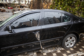 Shot cars. On the streets of Irpin. Cities of Ukraine after the Russian occupation. Irpin, Bucha,...