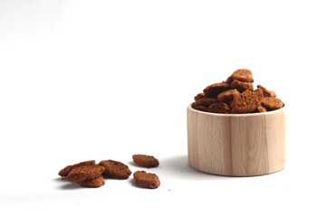 baked breads in a wooden bowl isolated on white background