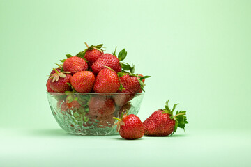 strawberries in a plate on an olive background