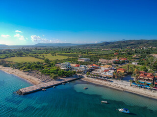 Fototapeta na wymiar Panoramic aerial view over Gialova seaside city in Navarino bay. It is one of the best touristic places located in Messenia, Greece