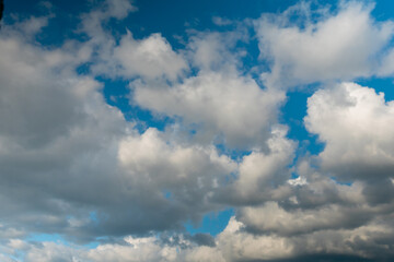 Dramatic white clouds against blue sky. Daylight, cloudy day. Nature, freedom and peaceful concept