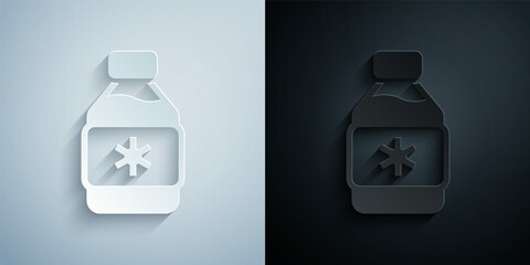 Paper cut Bottle of medicine syrup icon isolated on grey and black background. Paper art style. Vector