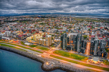 Fototapeta premium Aerial View of the rapidly growing Urban Center of Reykjavik, Iceland at Night during Summer