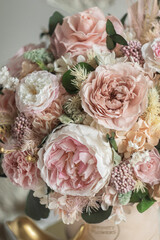 Beautiful box with hydrangeas and peonies. Soft pink roses and eucalyptus. Interior composition of flowers.