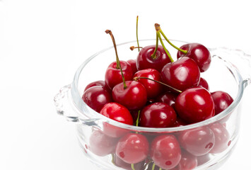 Obraz na płótnie Canvas Bunch of cherries on transparent plate white background